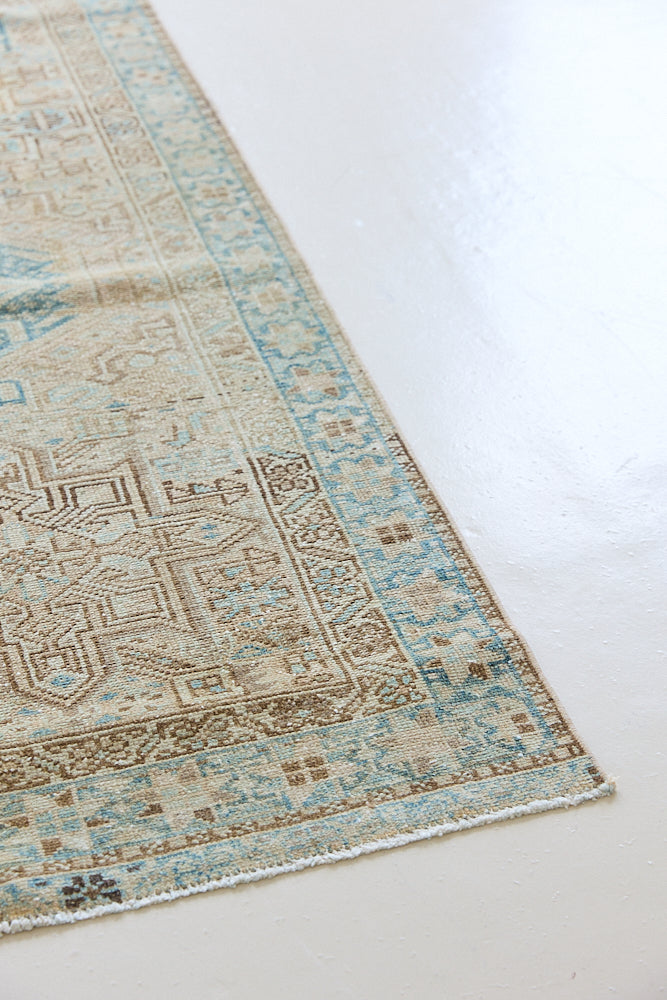 The Heriz is one of the most sought after and recognisable Persian designs, known for vibrant colours and bold geometric patterns. This runner features a beautiful colour palette of taupe, blue and muted brown.