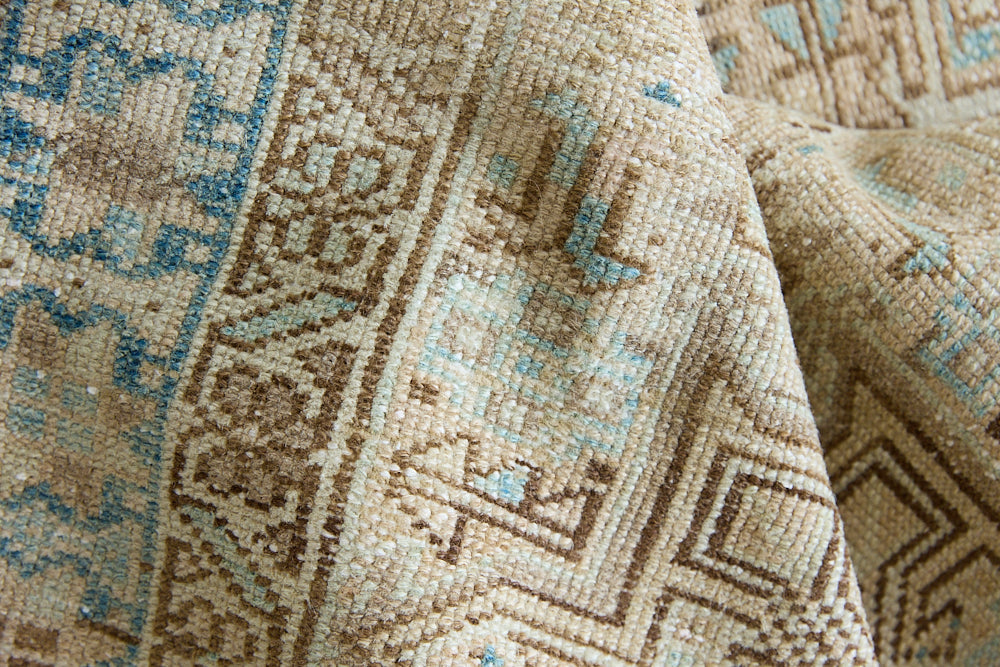 The Heriz is one of the most sought after and recognisable Persian designs, known for vibrant colours and bold geometric patterns. This runner features a beautiful colour palette of taupe, blue and muted brown.