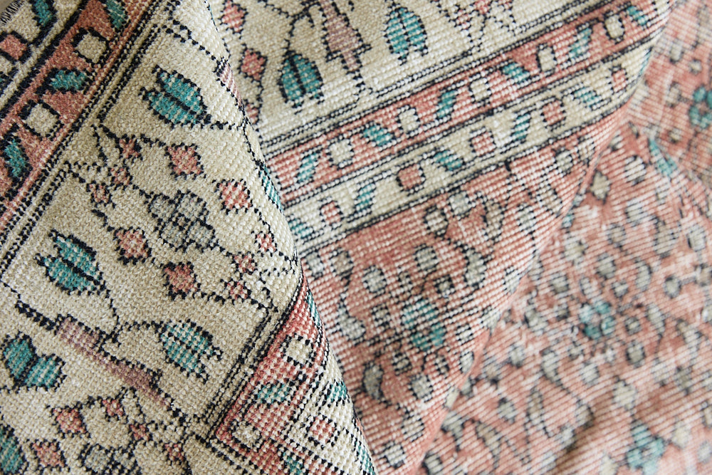 Dot is a vintage Turkish wool rug handwoven in Turkey approximately 80 years ago. The warm terracotta field and is decorated with an all floral scrolls pattern framed by a contrasting taupe boarder. 
