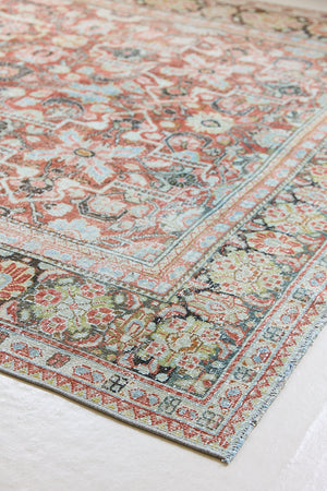 Mahals are known for decorative designs and repeating floral patterns. This antique rug features a beautiful earthy red ground complimented by a dark blue border.