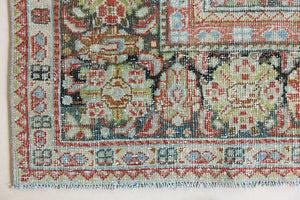 Mahals are known for decorative designs and repeating floral patterns. This antique rug features a beautiful earthy red ground complimented by a dark blue border.