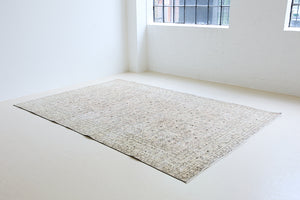 Josie is a vintage wool rug handwoven in Turkey approximately 80 years ago. The soft pink field and is decorated with an all floral scrolls pattern framed by a subtle contrasting taupe boarder.