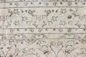 Josie is a vintage wool rug handwoven in Turkey approximately 80 years ago. The soft pink field and is decorated with an all floral scrolls pattern framed by a subtle contrasting taupe boarder.