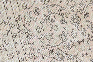 Josie is a vintage wool rug handwoven in Turkey approximately 80 years ago. The soft pink field and is decorated with an all floral scrolls pattern framed by a subtle contrasting taupe boarder.