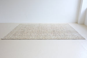 Josie is a vintage wool rug handwoven in Turkey approximately 80 years ago. The soft pink field and is decorated with an all floral scrolls pattern framed by a subtle contrasting taupe boarder.
