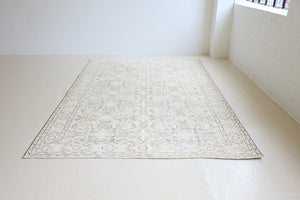 Lily is a vintage wool rug handwoven in Turkey approximately 80 years ago. The soft taupe field and is decorated with an all floral scrolls pattern framed by a subtle boarder.