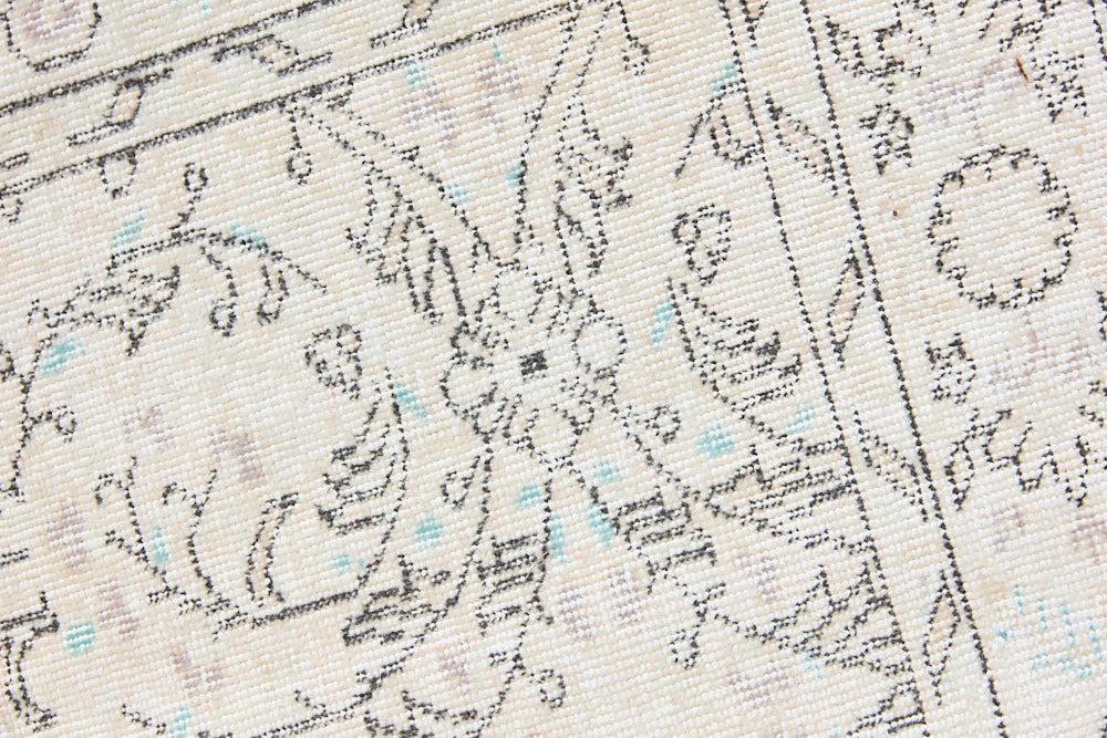 Lily is a vintage wool rug handwoven in Turkey approximately 80 years ago. The soft taupe field and is decorated with an all floral scrolls pattern framed by a subtle boarder.