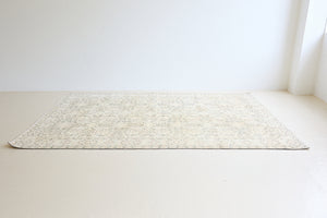 Lily is a vintage wool rug handwoven in Turkey approximately 80 years ago. The soft taupe field and is decorated with an all floral scrolls pattern framed by a subtle boarder.