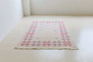 Ola is an original 1960s röllakan flatweave, featuring a pretty geometric floral pattern. The rug is signed ILS.