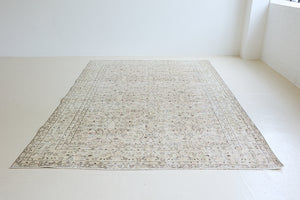Josie is a vintage wool rug handwoven in Turkey approximately 80 years ago. The soft pink field and is decorated with an all floral scrolls pattern framed by a subtle contrasting taupe boarder.