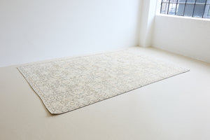Lily is a vintage wool rug handwoven in Turkey approximately 80 years ago. The soft taupe field and is decorated with an all floral scrolls pattern framed by a subtle boarder.