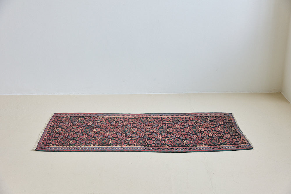 Woven in the Kurdish highlands of northwest Iran, Senneh kilims are distinguished by an exceptional fineness of weave with a tight slit-tapestry construction with a high level of intricacy. Celestine features a decorative all over pattern in pinks, blues and greens on a black field.