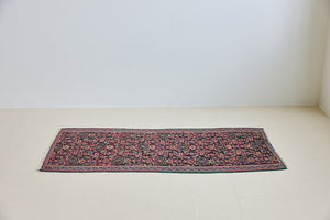 Woven in the Kurdish highlands of northwest Iran, Senneh kilims are distinguished by an exceptional fineness of weave with a tight slit-tapestry construction with a high level of intricacy. Celestine features a decorative all over pattern in pinks, blues and greens on a black field.