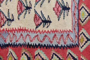 Delara is a pretty, geometric Anatolian kilim rug. Hand-woven on village and nomadic looms in vivid, naturally dyed colours, a tradition stretching back thousands of years. Kilims were woven for the practicalities of daily life and used as floor and wall coverings, storage bags, and prayer mats. Delara features a bright red floral motif across a taupe field with a contrasting taupe boarder.