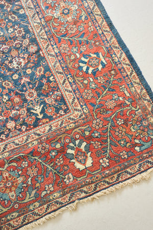 Farahan rugs are known for their high quality and are some of the most valuable Persian styles known for their repeating all over designs. Adeline is a large rug featuring a beautiful, intricate all over design on a dark blue ground with red boarder.