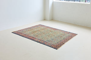 Claudette is a beautiful antique Senneh rug with an intricate design. Senneh rugs are known for their fine and intricate patterns and distinctive weaving technique. Claudette has an intricate botteh pattern and a pleasing colour palette of yellow, muted red and blue.
