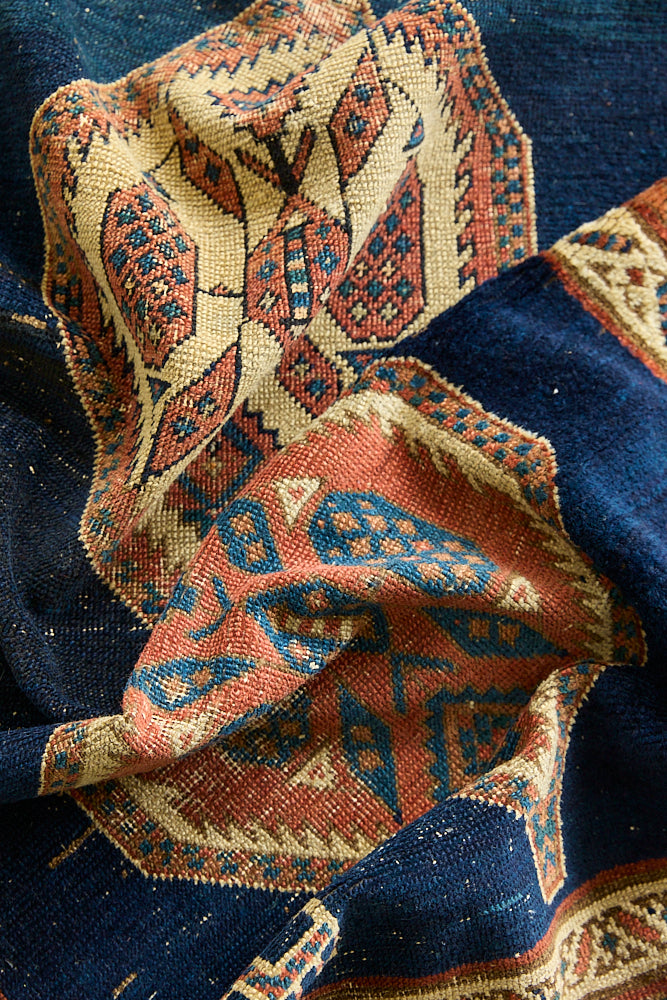 Seraphine is a beautiful antique Oushak runner with a peachy pink repeating pattern on a dark blue ground. Oushak rugs are among the most celebrated of all Turkish weavings, prized for their soft, luminous palettes and characteristically open, large-scale designs