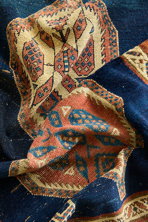 Seraphine is a beautiful antique Oushak runner with a peachy pink repeating pattern on a dark blue ground. Oushak rugs are among the most celebrated of all Turkish weavings, prized for their soft, luminous palettes and characteristically open, large-scale designs