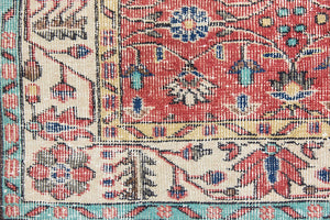 Glenda is a vintage wool rug handwoven in Turkey approximately 80 years ago. The warm terracotta field and is decorated with an all floral scrolls pattern framed by a contrasting taupe boarder.
