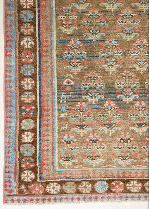 Decorative antique Persian runner with intricate patterns and colours. 