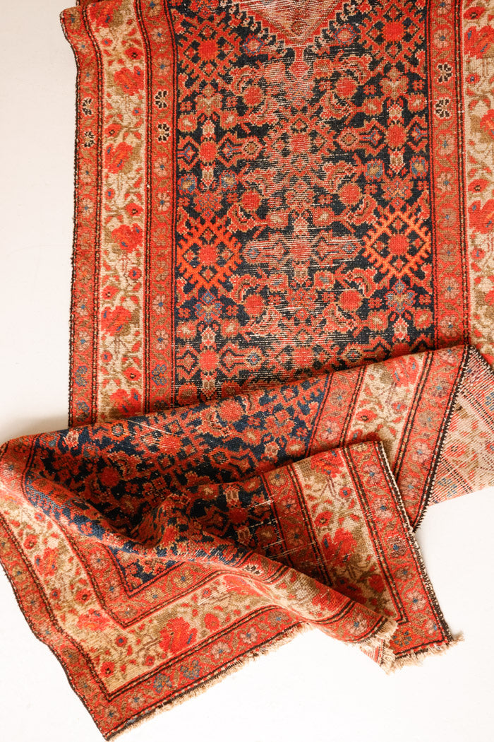 The Malayer region is known for producing some of the most ornate Persian carpets, often known for their mesmerising and intricate repeating patterns.This extra long handwoven vintage runner rug features a beautiful intricate design and lots of character and charm.