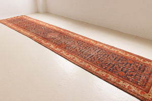 The Malayer region is known for producing some of the most ornate Persian carpets, often known for their mesmerising and intricate repeating patterns.This extra long handwoven vintage runner rug features a beautiful intricate design and lots of character and charm.