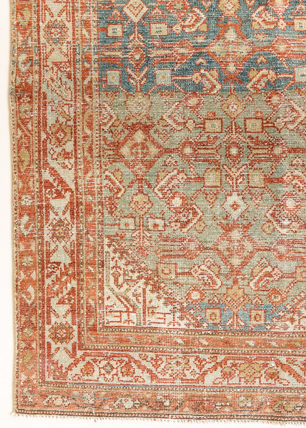 This is a Persian Malayer runner rug with a beautiful palette of blues and terracotta and a wonderful patina. Persia produces this finest carpets and this is one of them.