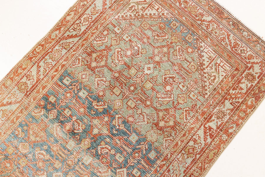 This is a Persian Malayer runner rug with a beautiful palette of blues and terracotta and a wonderful patina. Persia produces this finest carpets and this is one of them.