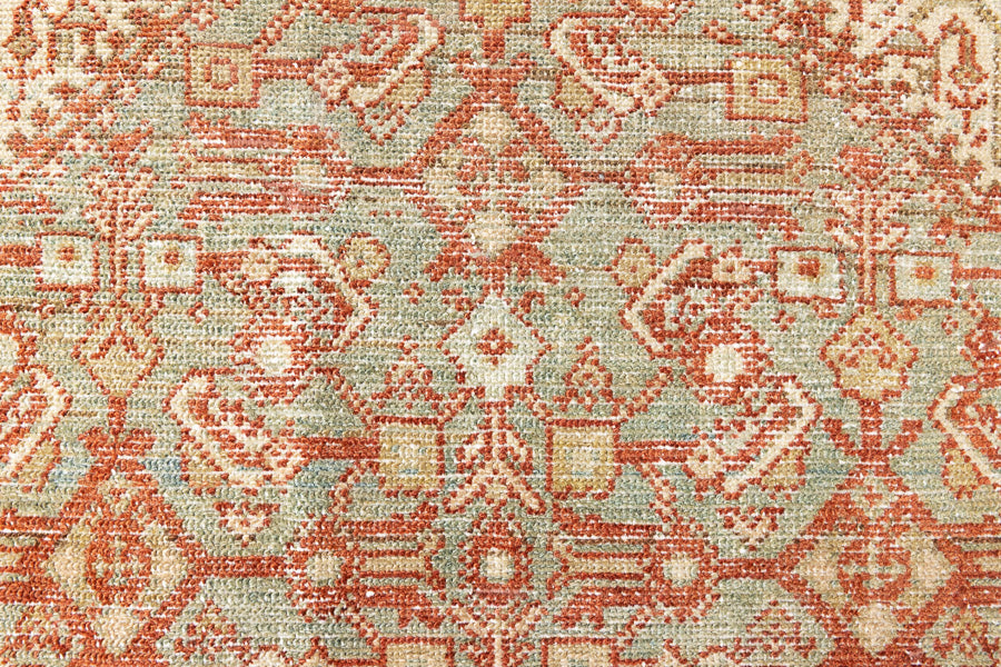 This is a Persian Malayer runner rug with a beautiful palette of blues and terracotta and a wonderful patina. Persia produces this finest carpets and this is one of them.