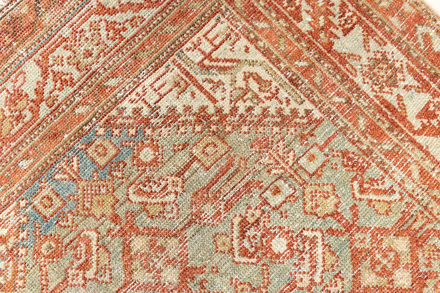 This is a Persian Malayer runner rug with a beautiful palette of blues and terracotta and a wonderful patina. Persia produces this finest carpets and this is one of them.