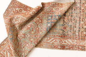 This is a Persian Malayer runner rug with a beautiful palette of blues and terracotta and a wonderful patina. Persia produces this finest carpets and this is one of them.