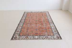 Introducing Amber, a handmade vintage Turkish rug. This beautiful vintage carpet features a beautiful rust colour palette and floral design.