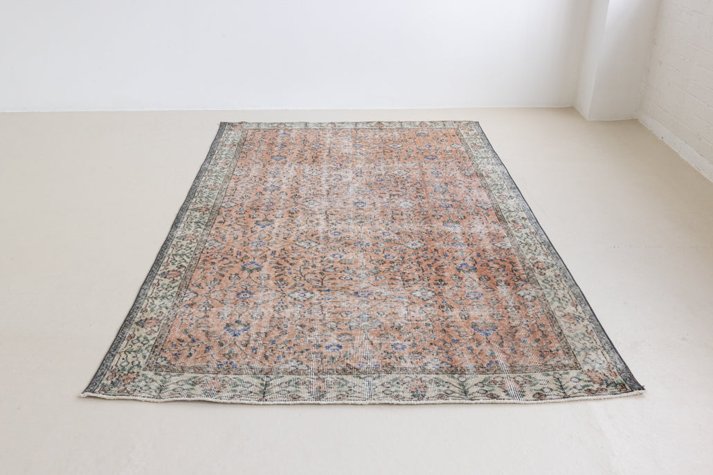 Ines is a vintage rug from Turkey, This gorgeous handwoven carpet features a lovely all over floral design and a soft colour palette. Shop our beautiful range of vintage rugs and carpets online now.
