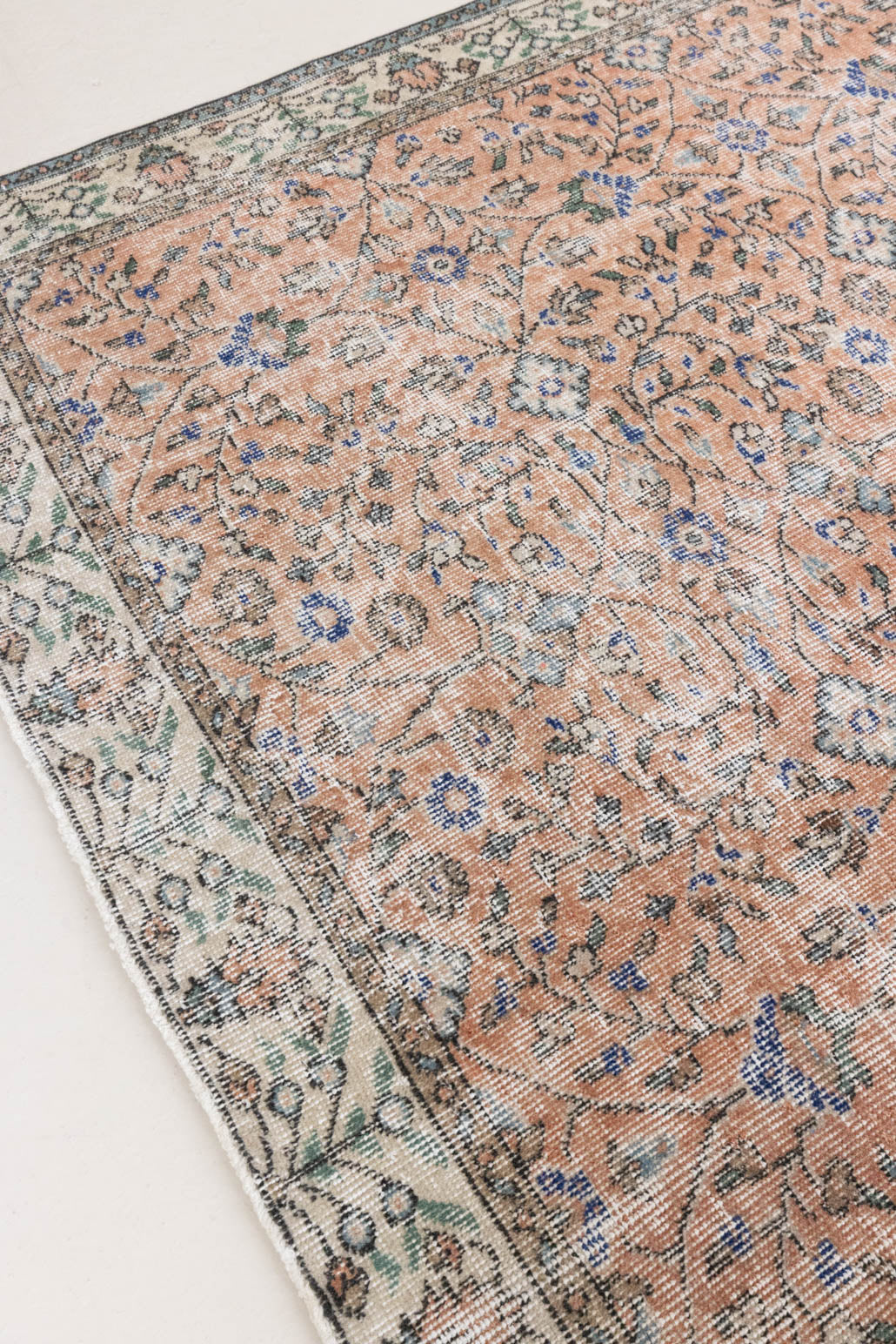 Ines is a vintage rug from Turkey, This gorgeous handwoven carpet features a lovely all over floral design and a soft colour palette. Shop our beautiful range of vintage rugs and carpets online now.