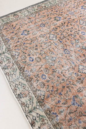 Ines is a vintage rug from Turkey, This gorgeous handwoven carpet features a lovely all over floral design and a soft colour palette. Shop our beautiful range of vintage rugs and carpets online now.