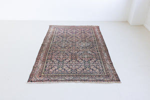 Eden is a muted pink antique Persian Malayer rug, handwoven in the North West of Iran. The Malayer region is known for ornate Persian carpets. 