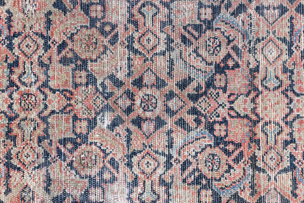 Eden is a muted pink antique Persian Malayer rug, handwoven in the North West of Iran. The Malayer region is known for ornate Persian carpets. 