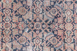 Eden is a muted pink antique Persian Malayer rug, handwoven in the North West of Iran. The Malayer region is known for ornate Persian carpets. 