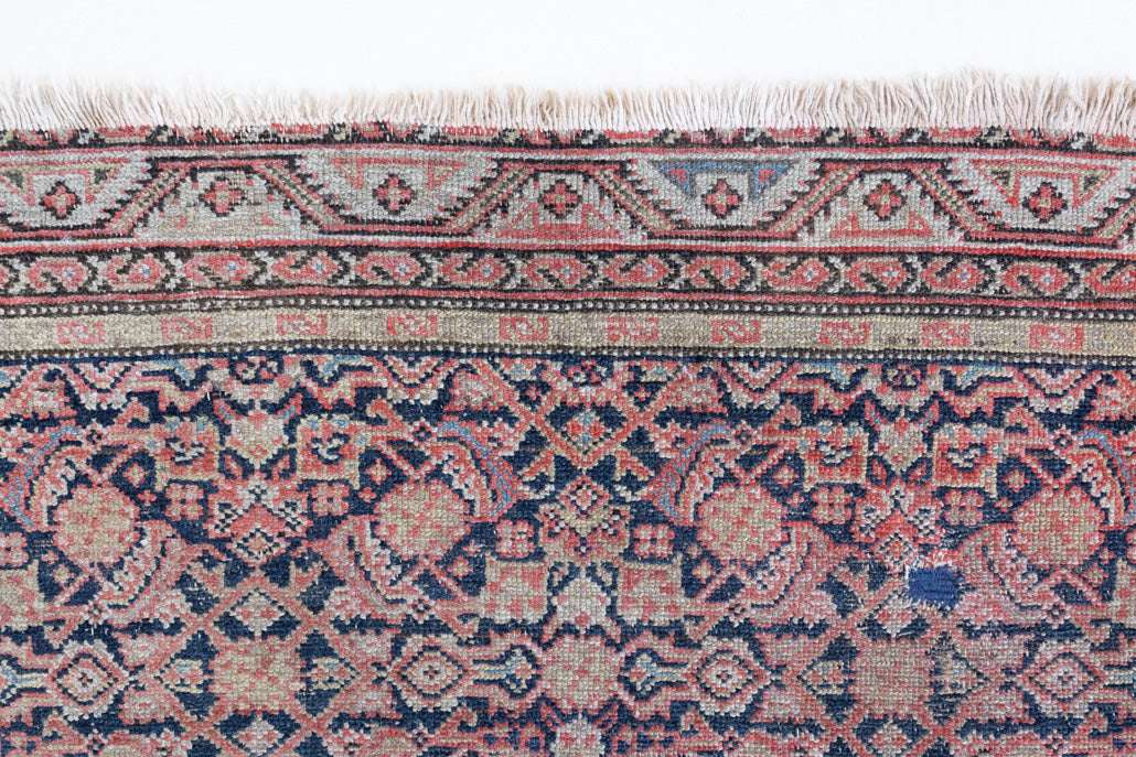 Eden is a muted pink antique Persian Malayer rug, handwoven in the North West of Iran. The Malayer region is known for ornate Persian carpets. 