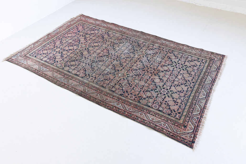 Eden is a muted pink antique Persian Malayer rug, handwoven in the North West of Iran. The Malayer region is known for ornate Persian carpets. 
