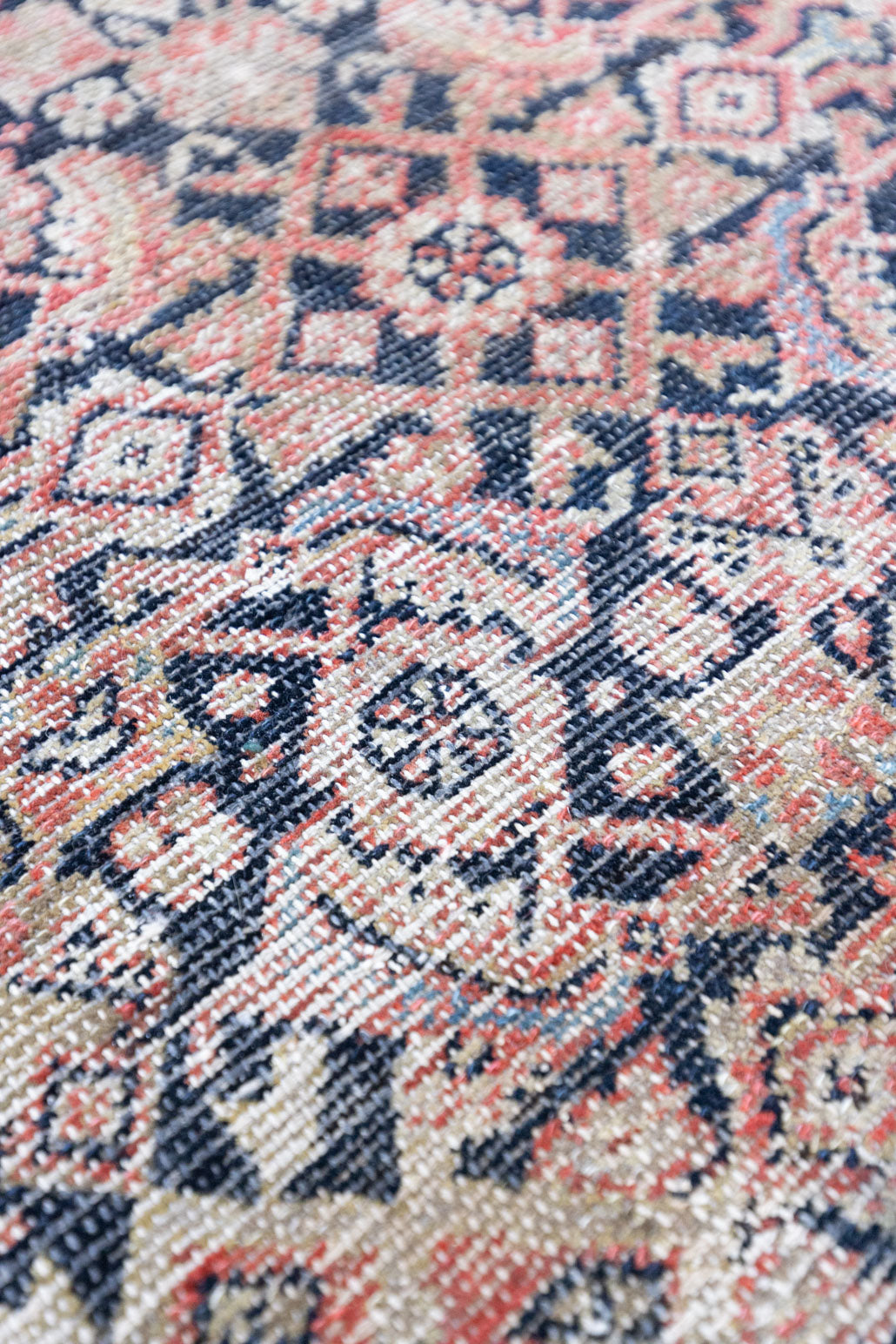 Eden is a muted pink antique Persian Malayer rug, handwoven in the North West of Iran. The Malayer region is known for ornate Persian carpets. 
