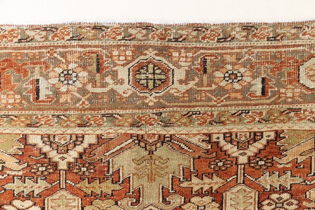 This is a antique Persian Heriz rug that has been over-dyed to gently fade its original colours, giving a more neutral palette. Persia has the most desirable rugs and carpets with stunning designs such as this carpet. Now available at Ourika London.