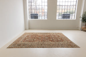 This is a antique Persian Heriz rug that has been over-dyed to gently fade its original colours, giving a more neutral palette. Persia has the most desirable rugs and carpets with stunning designs such as this carpet. Now available at Ourika London.