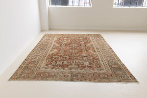 This is a antique Persian Heriz rug that has been over-dyed to gently fade its original colours, giving a more neutral palette. Persia has the most desirable rugs and carpets with stunning designs such as this carpet. Now available at Ourika London.
