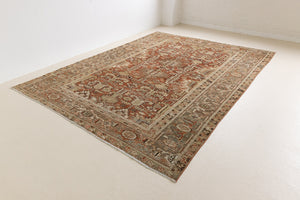 This is a antique Persian Heriz rug that has been over-dyed to gently fade its original colours, giving a more neutral palette. Persia has the most desirable rugs and carpets with stunning designs such as this carpet. Now available at Ourika London.