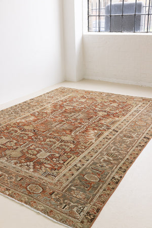 This is a antique Persian Heriz rug that has been over-dyed to gently fade its original colours, giving a more neutral palette. Persia has the most desirable rugs and carpets with stunning designs such as this carpet. Now available at Ourika London.
