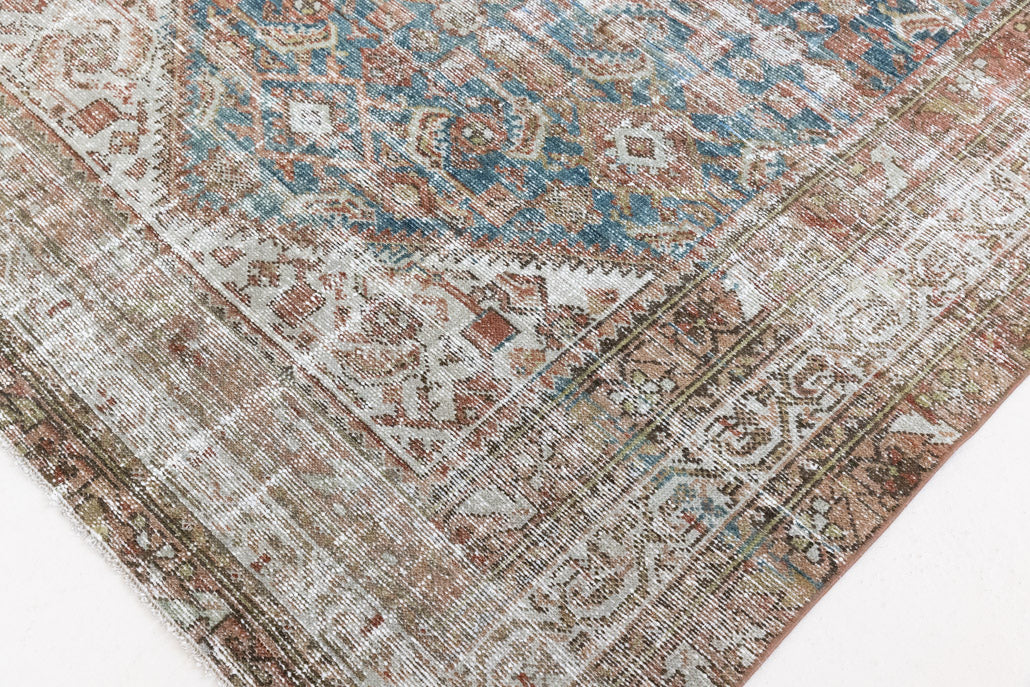 This is a antique Persian Malayer rug that has been over-dyed to gently fade its original colours, giving a more neutral palette. Persia has the most desirable rugs and carpets with stunning designs such as this carpet. Now available at Ourika London.