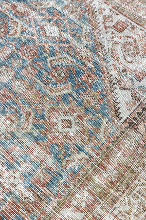 This is a antique Persian Malayer rug that has been over-dyed to gently fade its original colours, giving a more neutral palette. Persia has the most desirable rugs and carpets with stunning designs such as this carpet. Now available at Ourika London.