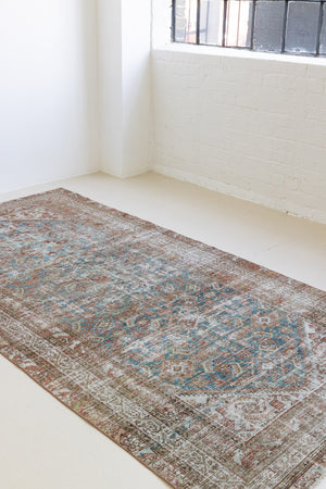 This is a antique Persian Malayer rug that has been over-dyed to gently fade its original colours, giving a more neutral palette. Persia has the most desirable rugs and carpets with stunning designs such as this carpet. Now available at Ourika London.