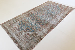 This is a antique Persian Malayer rug that has been over-dyed to gently fade its original colours, giving a more neutral palette. Persia has the most desirable rugs and carpets with stunning designs such as this carpet. Now available at Ourika London.